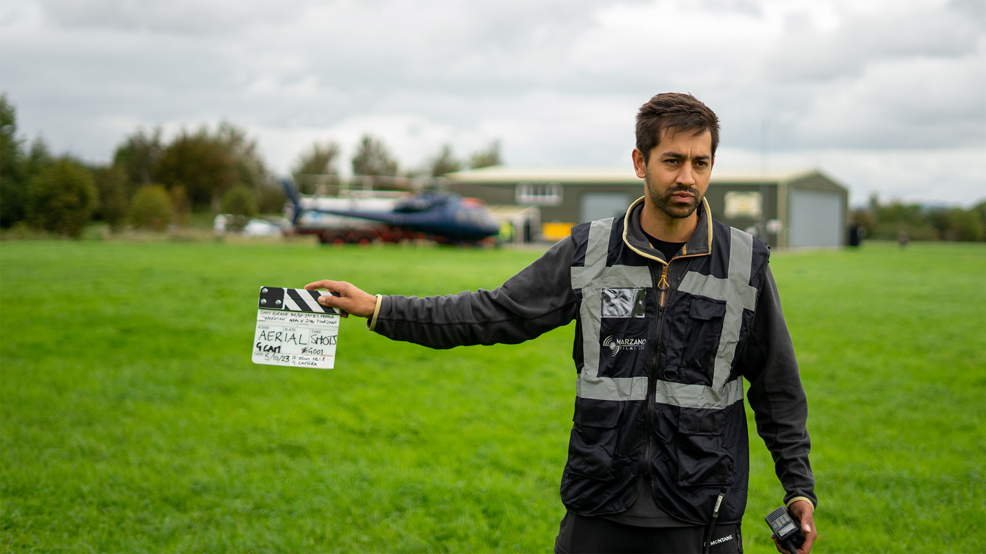 marzano crew member with clapper board